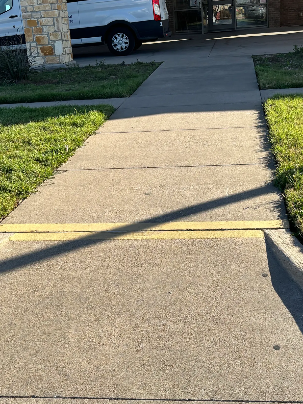 Main entry sidewalk after lifting and leveling repair